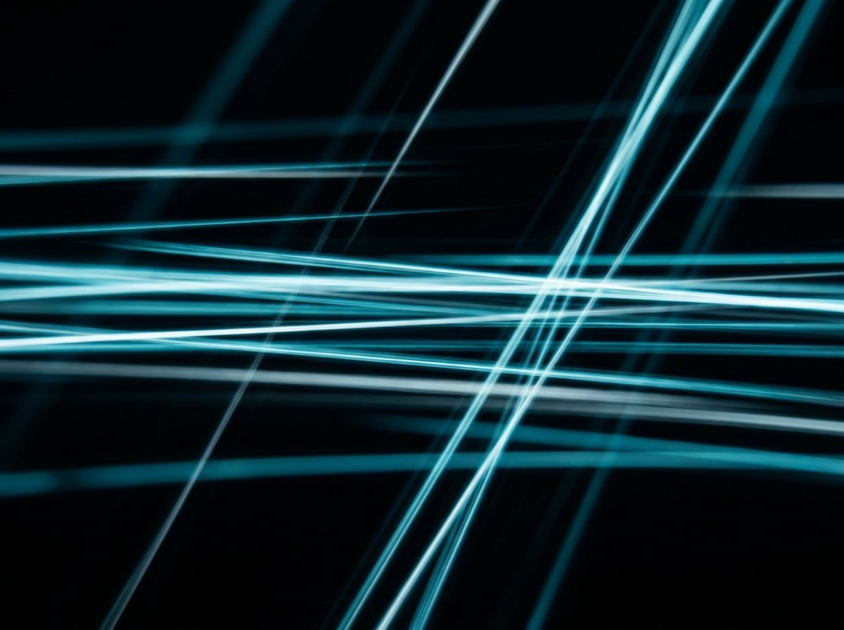 Abstract motion streaks of teal and white light suggesting keyboard-first instant speed